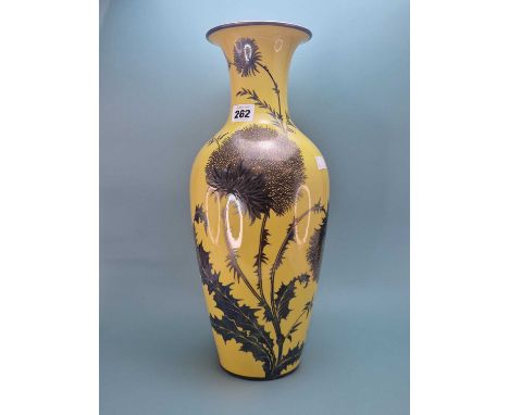 A Rosenthal silver overlay yellow ground vase decorated with thistles.   H 42.5cms. 