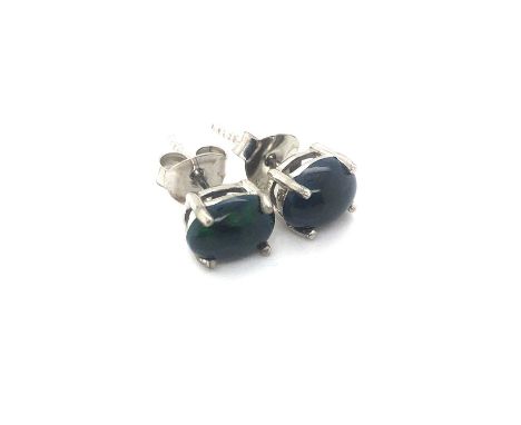 A pair of Ethiopian black opal stud earrings set in silver. 