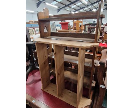 An arts and crafts style oak bookcase and a pine wall shelf.