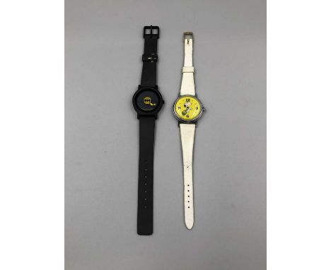 A vintage 1958 Snoopy manual wound Timex wristwatch, yellow dial with a minute hand tennis ball, winds and runs for the hour 
