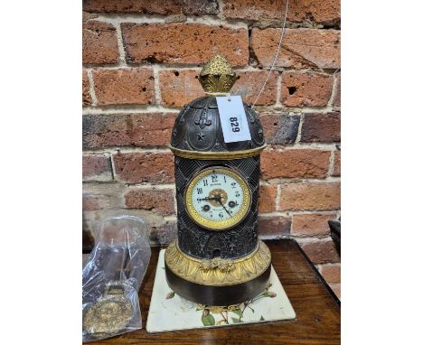 A 19th-century Bronze &amp; Gilt bronze-cased table clock of stylised bee hive form. The french 8 day striking movement and e