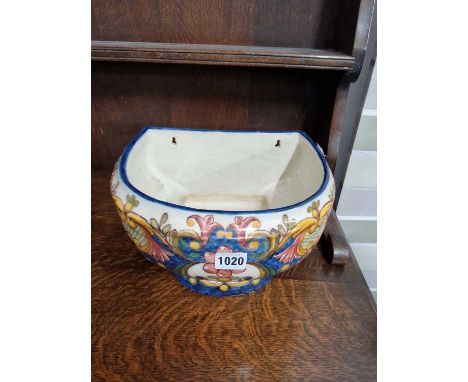 A continental pottery wall mounted planter.