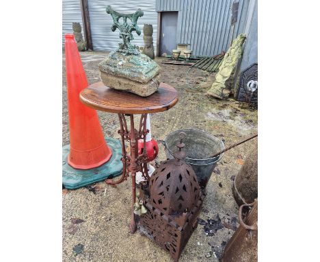 A cast metal table, a bootscraper, a metal lantern etc