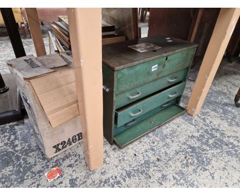 Vintage metal tool chest and a boxed tilly lamp.