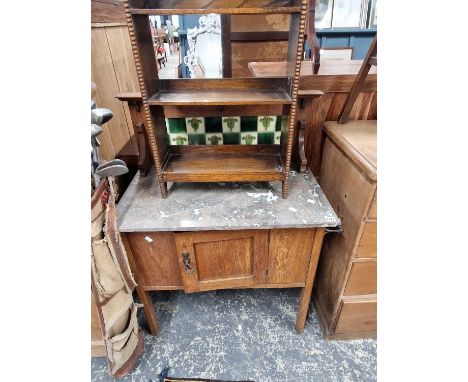 An Edwardian marble top, tile back washstand and a small oak bookcase.