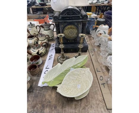 A black slate mantel clock, an oil lamp, a pair of brass candlesticks together with Carlton and other leaf shaped dishes