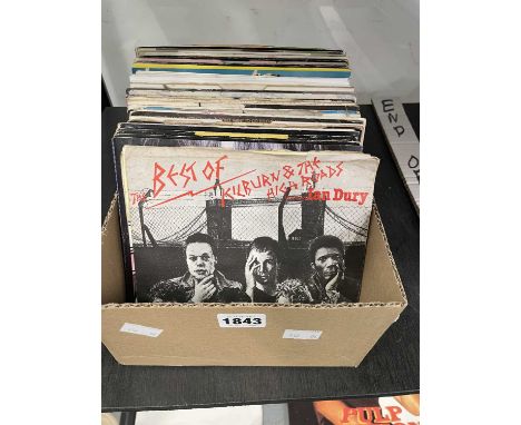 A collection of 45rpm single records: Ian Dury, The Stranglers, Elvis Costello, Carly Simon and others. Some early Stiff reco