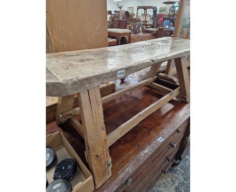 A rustic elm and pine low bench.