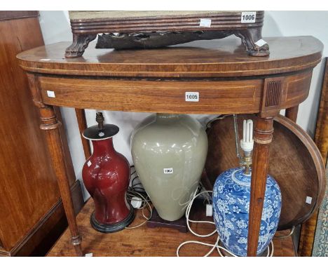 A late Georgian mahogany and inlaid foldover card table.