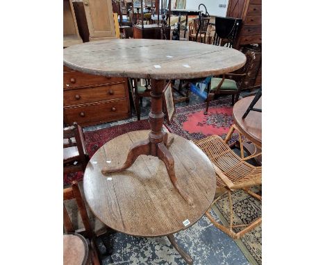 Two late 18th century oak tilt top tripod tables,