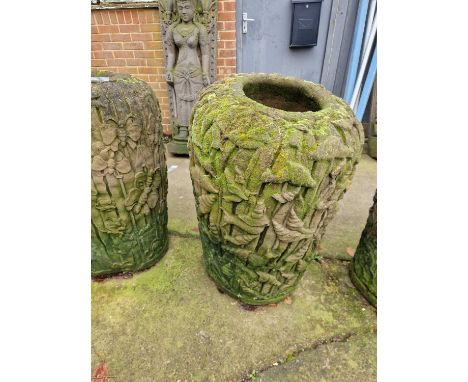 A Tall far eastern stone terrace vase/ planter, decorated with snails and leaves