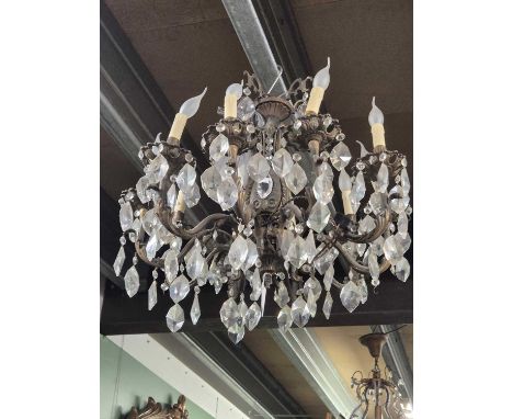 A cast metal and glass ten arm chandelier