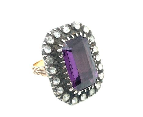 A vintage large cocktail-style ring. Unhallmarked assessed variously between 16-17ct on the floral engraved gold shank, 12ct 