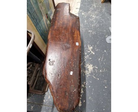 A rustic pine and elm bench.