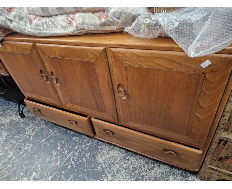 An ercol pale elm sideboard.