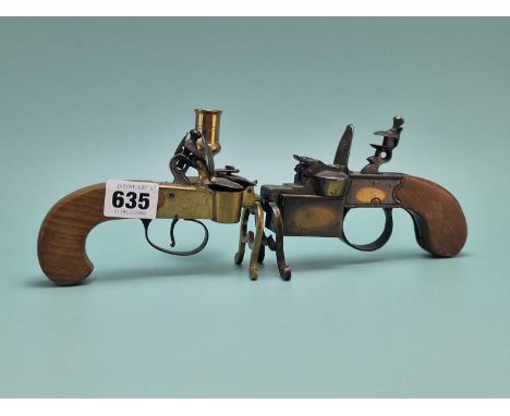 A Dunhill lighter in the form of a pistol tinder lighter and an Italian flintlock 18th-century style tinder lighter.