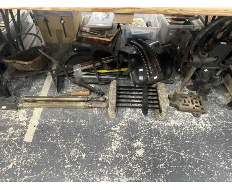 A boot scraper, various tools, a table top drill, two brass pumps, an iron soldier door stop, etc
