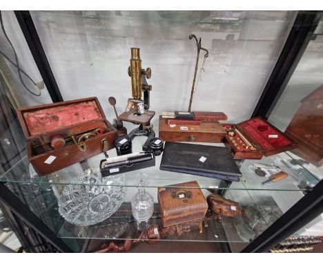 A Hearson microscope, calculators, a hydrometer, balance scales, camera lenses, a magneto-electric machine, etc