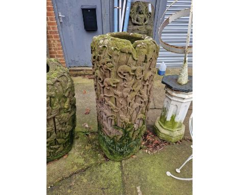 A Tall far eastern stone terrace vase/ planter, decorated with rats and leaves