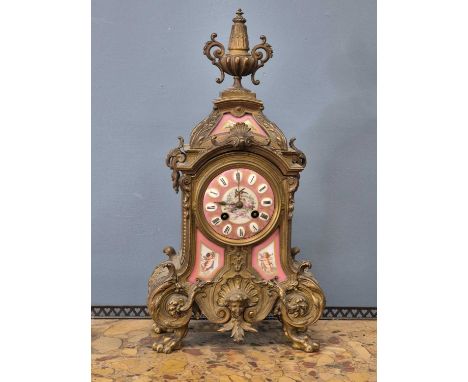 A Victorian gilt brass Mantle clock with Inset porcelain panel decoration. 8-day French striking movement.