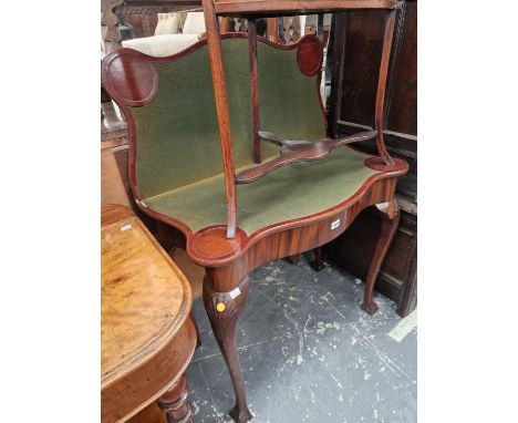 A George II-style mahogany serpentine foldover card table.