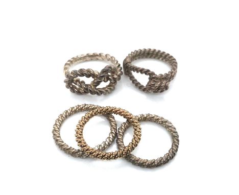 A set of three stacking rings, unhallmarked, assessed as the following, two 925 silver and one 9ct gold. Ring size M, K 1/2, 