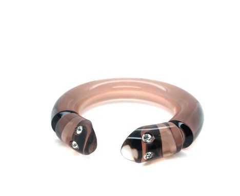 An unusual vintage bangle, the opening in the form of two snake heads with inset foil back rhinestones.