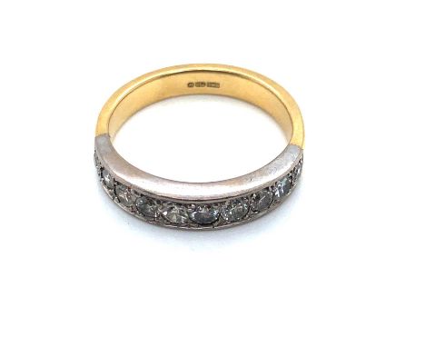 A vintage 18ct hallmarked gold diamond half-eternity ring. Ring size L 1/2. Weight 4.57 grams.