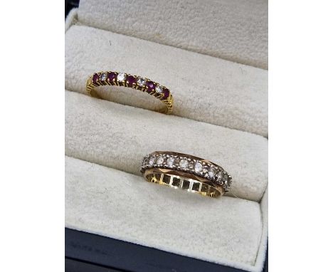 An 18ct hallmarked gold, ruby and diamond half eternity ring, and a 9ct gem set full eternity ring. Ring sizes R and N. Gross