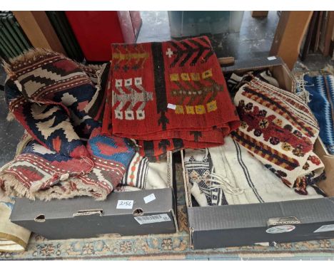 Three Kelim rugs and other textiles.