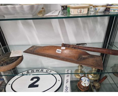 A P&amp;O ship insignia, a truncheon and a mahogany ship's half hull mounted on board