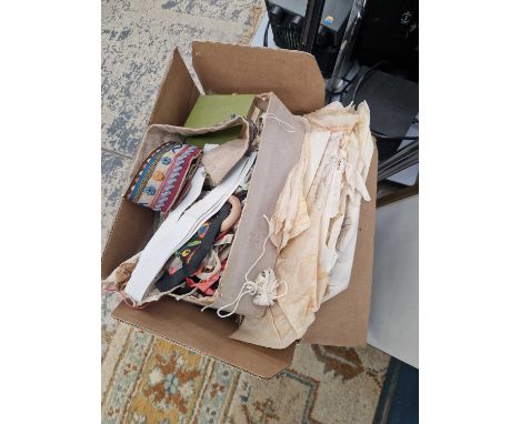 A box of antique and later sewing equipment, textiles, lace makers patterns etc,