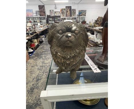 A life size gilt plaster model of a Pekinese