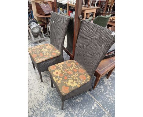 A pair of loom conservatory dining chairs.