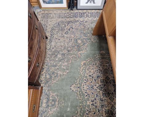 A machine made carpet of Persian design 456 x 318 cm