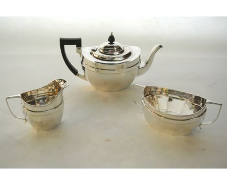 A George V silver three-piece tea set, Herbert Edward Barker & Frank Ernest Barker, Chester, 1923, comprising: a teapot, a mi