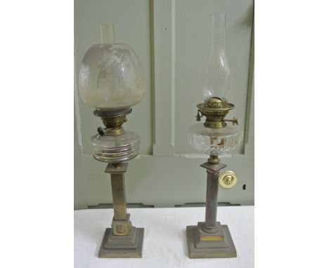 A Victorian brass oil lamp the square classical type column with applied lions mask detail and square graduated step base, mo
