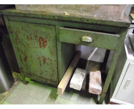 A vintage metal framed workbench with timber top, frieze drawer and cupboard 