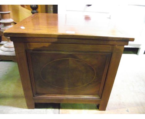 A late Victorian mahogany commode of square cut form with rising lid, the framework with chequered string, box wood and other