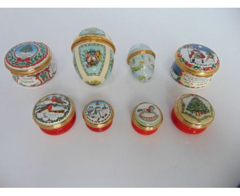 A collection of six Halcyon Days enamel Christmas trinket and pill boxes including examples dated 1988 and 1990 together with