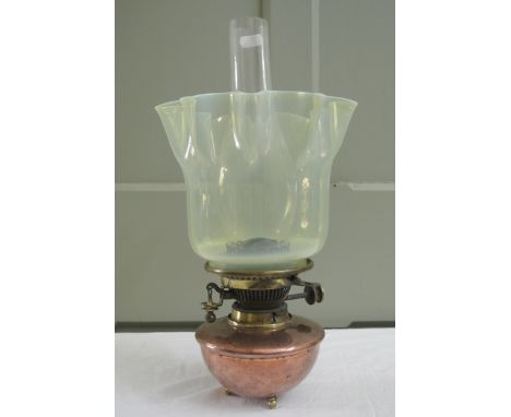 Attributed to W A S Benson, a small copper oil lamp with three brass feet, Hinks no2 Duplex burner with ceramic button and li