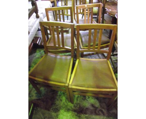 A set of 8(6&2) mid 20th century oak stick back dining chairs with upholstered seats on square cut supports
