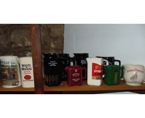 A collection of pub related jugs including examples for Passport Scotch, Seagram's 100 Pipers Deluxe Scotch Whisky, Long John