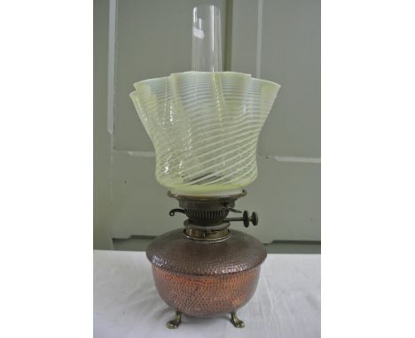 An Arts and Crafts copper oil lamp the base with stamped marks for Benham & Froud, the copper font with hammered finish suppo