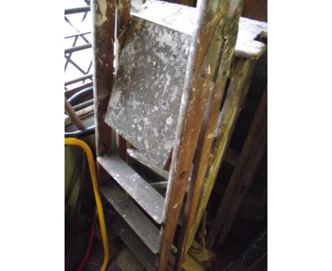 A vintage pine A framed folding trestle together with two small folding step ladders