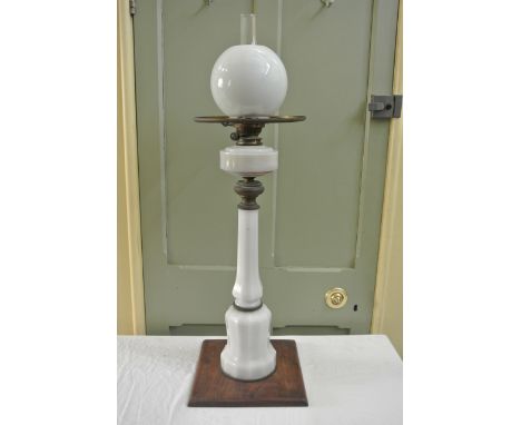 A large/tall Victorian oil lamp with milk glass faceted column and reservoir, messengers patent, A & N CS Limited brass burne
