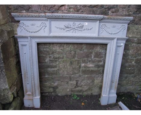 A reclaimed 19th century cast iron fire surround/chimney piece, with classical relief detailing and painted finish, mantle 18