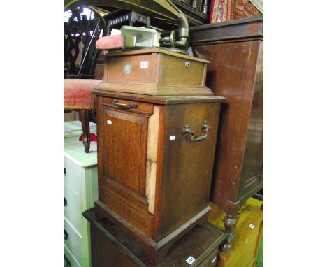 A vintage oak table top gramophone with parrot transfer logo and embossed brass flower shaped horn, together with winding han