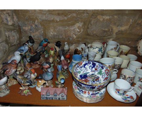 A collection of 19th century and other ceramics including a Staffordshire spaniel with red painted patches a ceramic cased ma