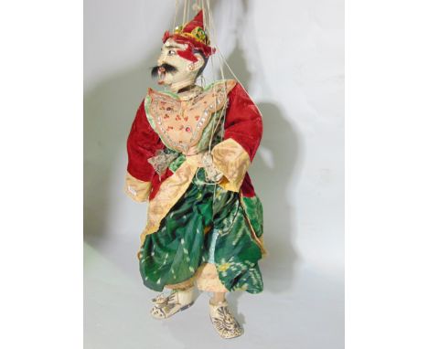 An Eastern puppet, in the form of a male character with brightly coloured costume, together with a needlework purse with blac